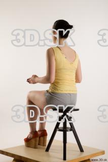 Sitting reference of whole body yellow t shirt gray shorts…